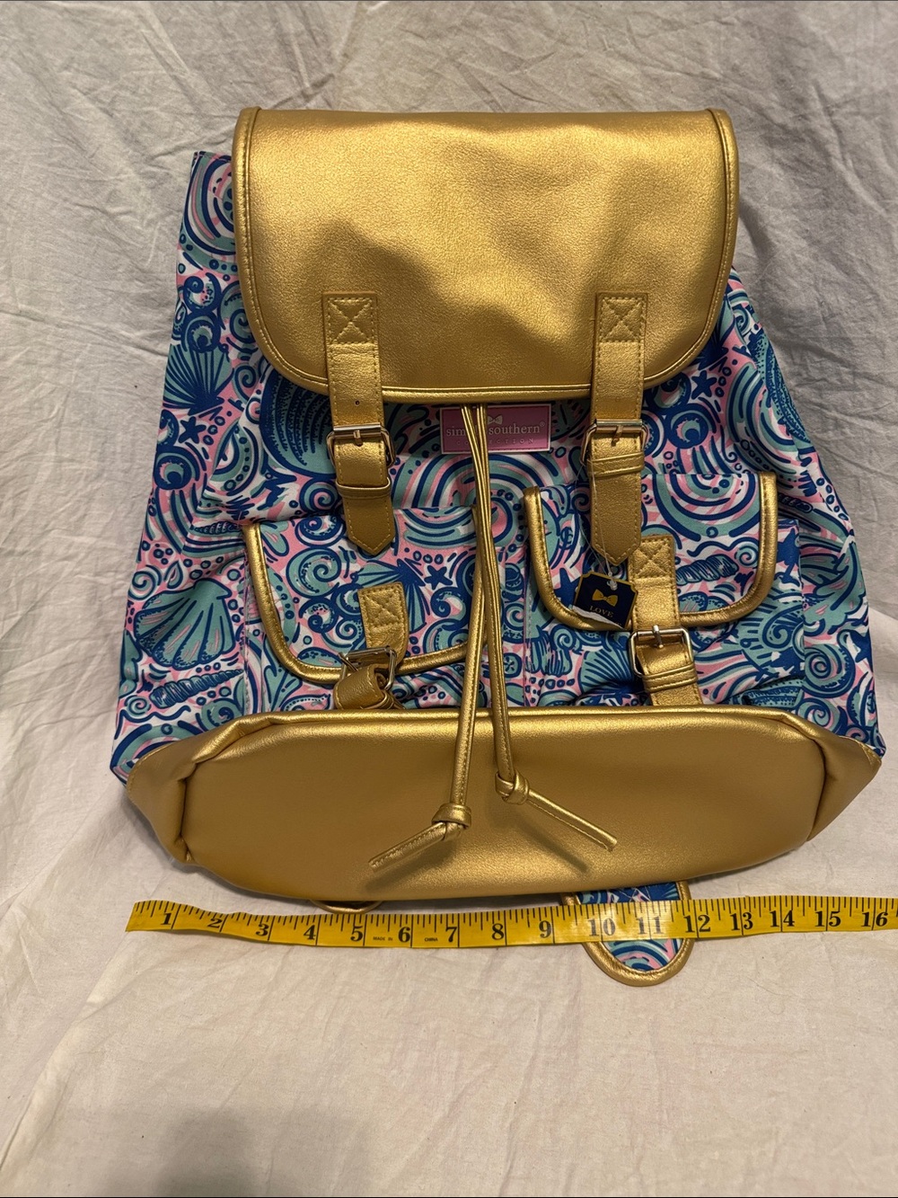 Simply Southern Gold Accent Drawstring Backpack with Blue and Pink Shell Print